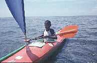 Child trying out sea kayak.